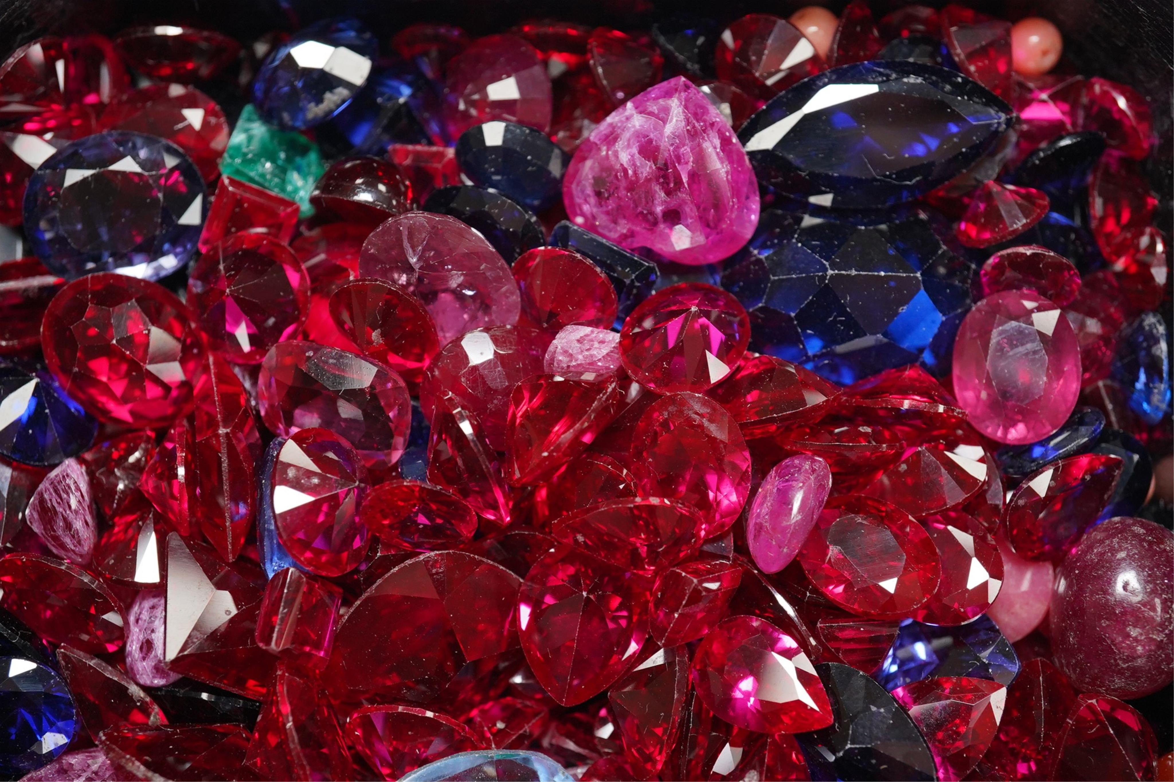 A quantity of assorted unmounted coloured gemstones. Condition - poor to fair